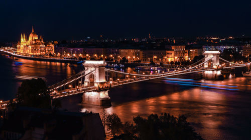 High angle view of illuminated bridge over river at night