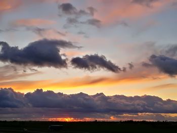 Scenic view of dramatic sky during sunset