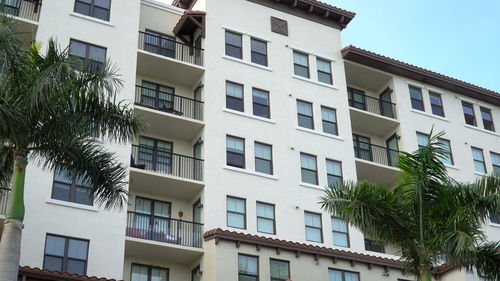 Low angle view of apartment building against sky