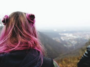 Close-up of woman against sky