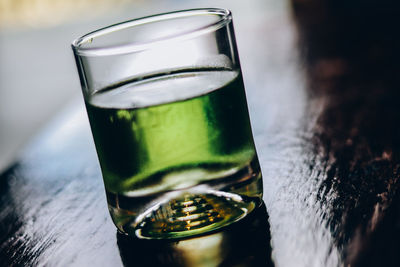 Close-up of beer glass on table