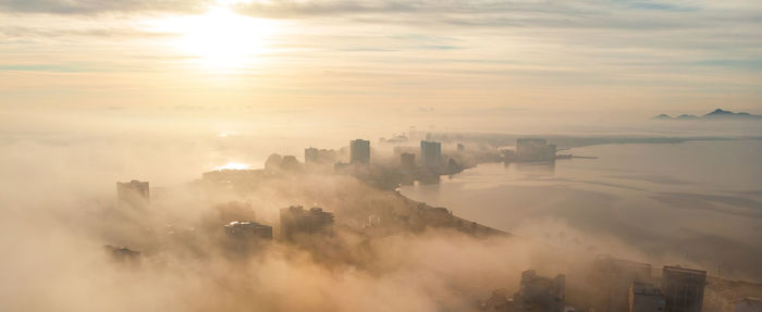 High angle view of buildings against sky during sunset