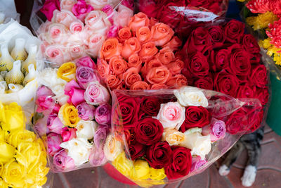 Multi colored roses on display at market stall