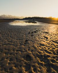 Scenic view of lake against sky during sunset