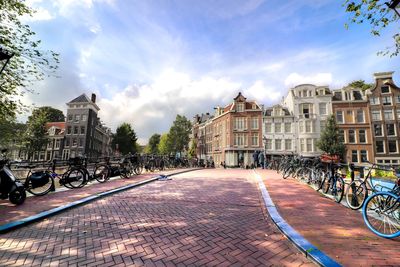 Street amidst buildings in town against sky