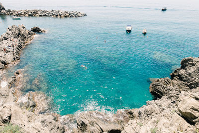 High angle view of sailboats in sea