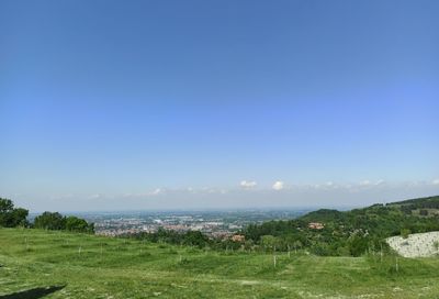 Scenic view of sea against clear blue sky