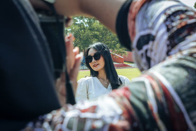 Low profile woman wearing sunglasses