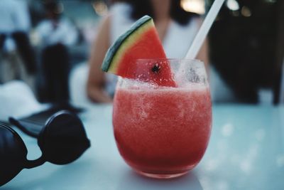 Close-up of cocktail in glass on table