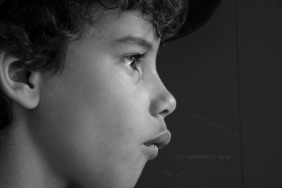 Close-up of boy against wall