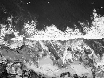 High angle view of snow by sea