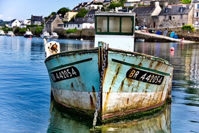 Close-up of boat moored in river