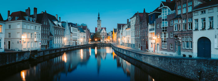 Canal passing through city buildings