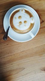 High angle view of cappuccino on table