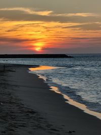 Scenic view of sea against sky during sunset