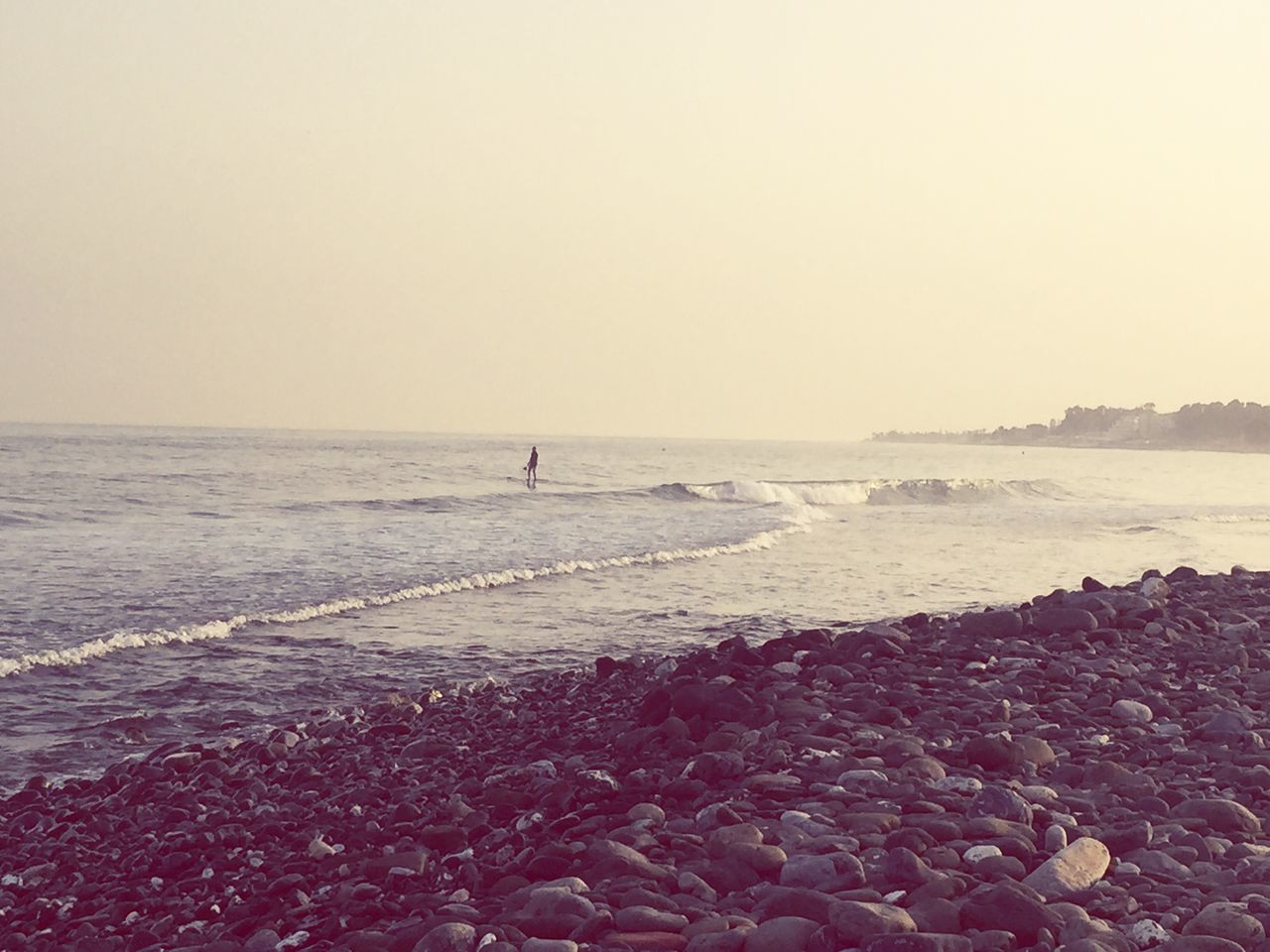 sea, water, beach, horizon over water, clear sky, shore, scenics, copy space, tranquil scene, tranquility, beauty in nature, nature, rock - object, idyllic, wave, sky, coastline, sand, outdoors, calm