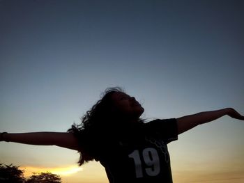 Woman looking at sunset