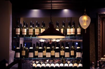 Row of wine bottles on shelf
