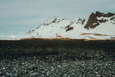 Reyniskirkja church near mountain landscape photo