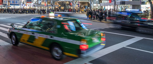 Blurred motion of vehicles on road in city