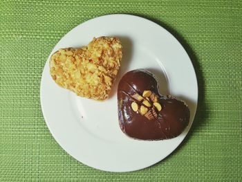 Directly above shot of heart shaped cookies on plate