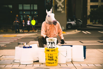 Man with text on street in city
