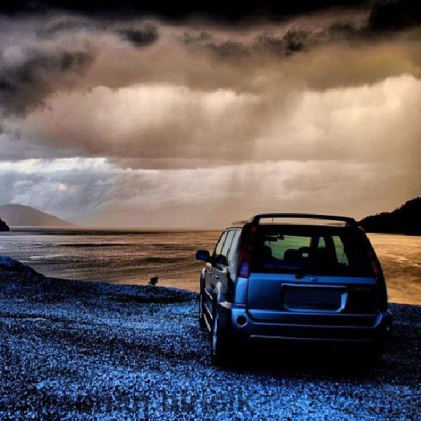 sky, transportation, beach, cloud - sky, land vehicle, mode of transport, sand, car, cloud, cloudy, sea, shore, tranquil scene, tranquility, nature, beauty in nature, horizon over water, scenics, outdoors, travel