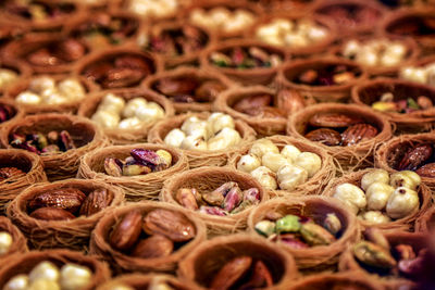 Full frame shot of nuts in containers