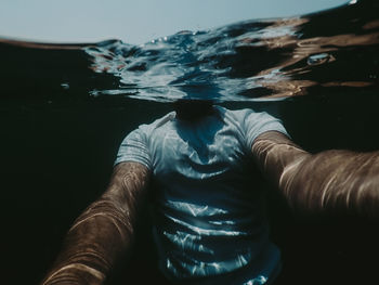 Man swimming in sea