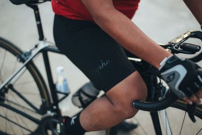 Low section of man riding bicycle