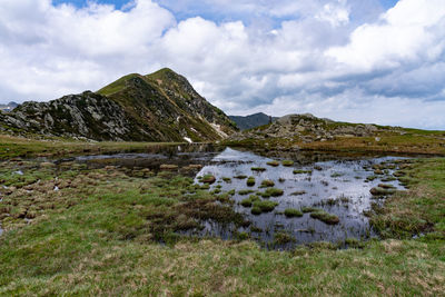 Scenic view of landscape and mountains against sky