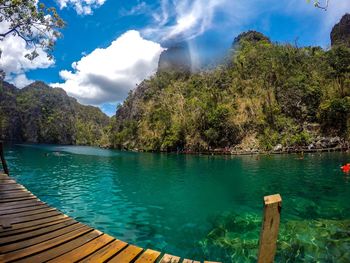 Scenic view of lake against cloudy sky