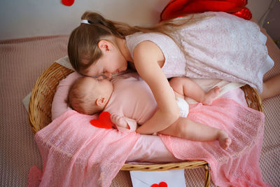 Valentine's day, a girl hugs her sister