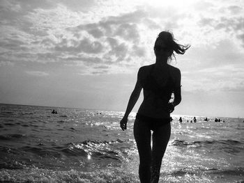 Scenic view of sea against cloudy sky