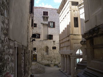 Narrow alley amidst buildings in town