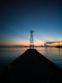 Scenic view of sea against clear sky during sunset