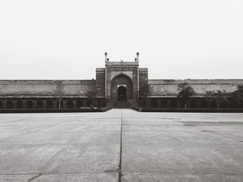 Entrance of historic building against clear sky