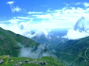 Scenic view of waterfall against sky