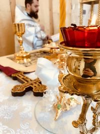 Midsection of woman sitting on table