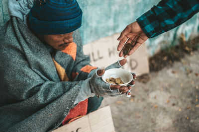 Midsection of man eating food