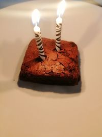 Burning candles on cake