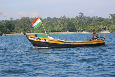 Scenic view of boat in sea against sky