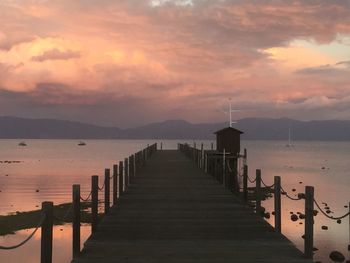 View of sunset over the lake and pier