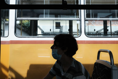 Man seen through train window