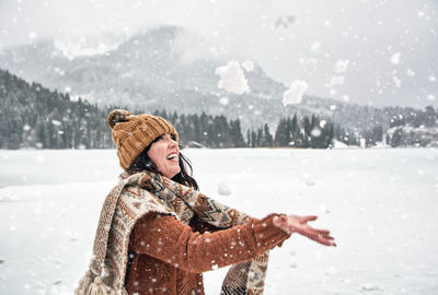 Young woman having fun in winter. snow, outdoors, happy.