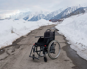 Bicycle on snow covered mountain