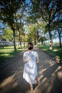 Rear view of woman walking in park