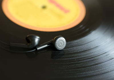 Music vinyl record and headphones close up