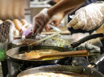 Midsection of man preparing food