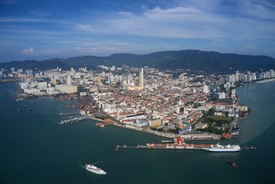 High angle view of harbor amidst buildings in city